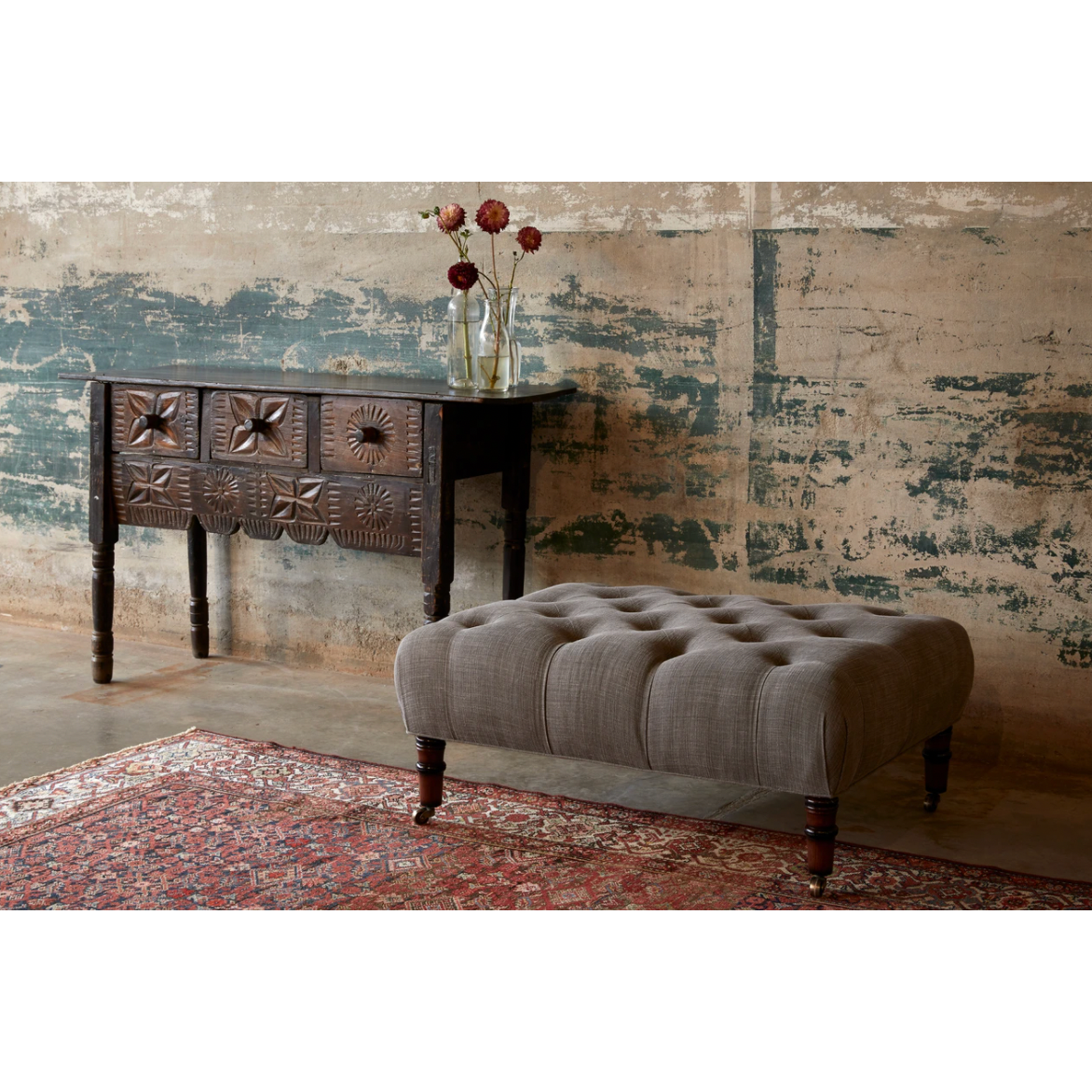 We love the versatility of this JD JD Field Ottoman by Cisco Home. With rolling legs, this can be used as extra seating, a coffee table, or a side table! Amethyst Home provides interior design, new home construction design consulting, vintage area rugs, and lighting in the Laguna Beach metro area.
