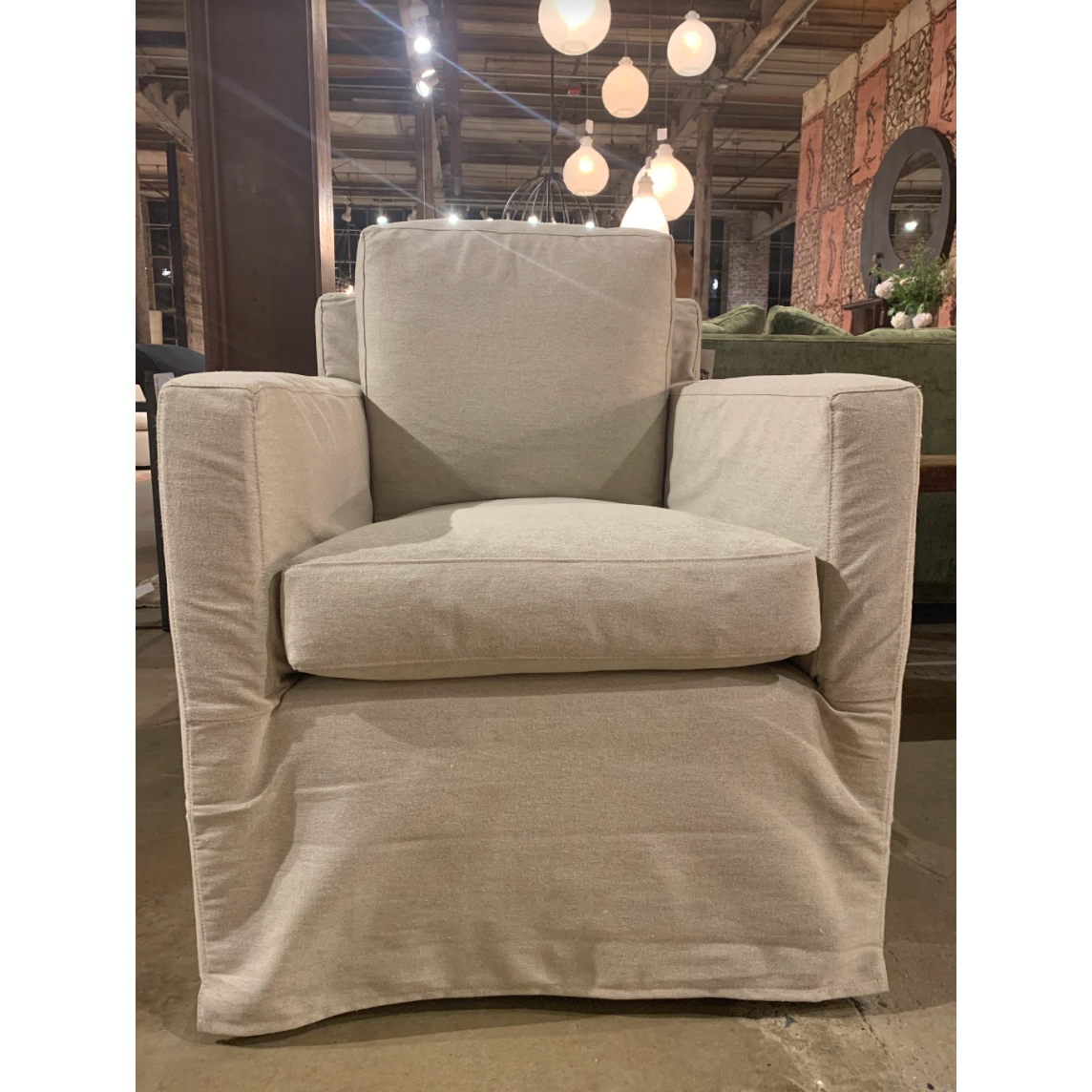 The Louis Chair by Cisco Brothers has an engaging profile and a sheltering, narrow seat. This design combines modern and coastal aesthetics with clean lines, a straight skirt, and a subtle 2" slit.A classic style with a scale that suits any living room or lounge area. Photographed in Logan Oatmeal. Lifestyle in Logan Grey. Amethyst Home provides interior design, new home construction design consulting, vintage area rugs, and lighting in the Calabasas metro area.