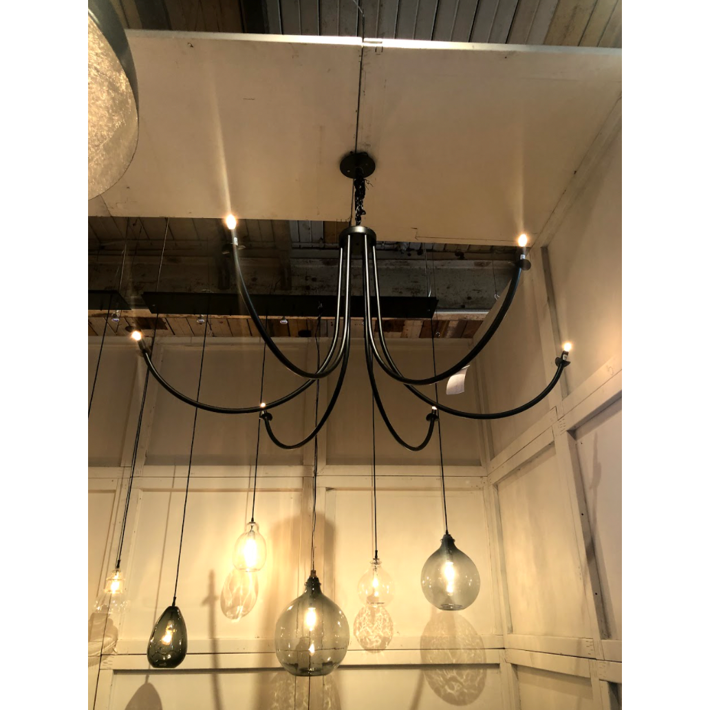 Add unique and modern lighting to a room with this Ramo Chandelier from Cisco Brothers. The curved arms add beautiful sight lines to the fixture and plenty of light.  Overall: 60”dia. 30.5"h Chain Length: 3' Canopy: 6"dia