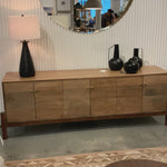 We love mid-century feel to this Reza Media Console - Smoked Honey. Finished in a light, smoked honey, a clean-lined parawood console sits in an arched cradle base of toasted acacia, for fresh contrast. Twist-lock metal hardware adds a clever finishing touch. Rear cutouts for media cord management. Amethyst Home provides interior design, new home construction design consulting, vintage area rugs, and lighting in the Los Angeles metro area.