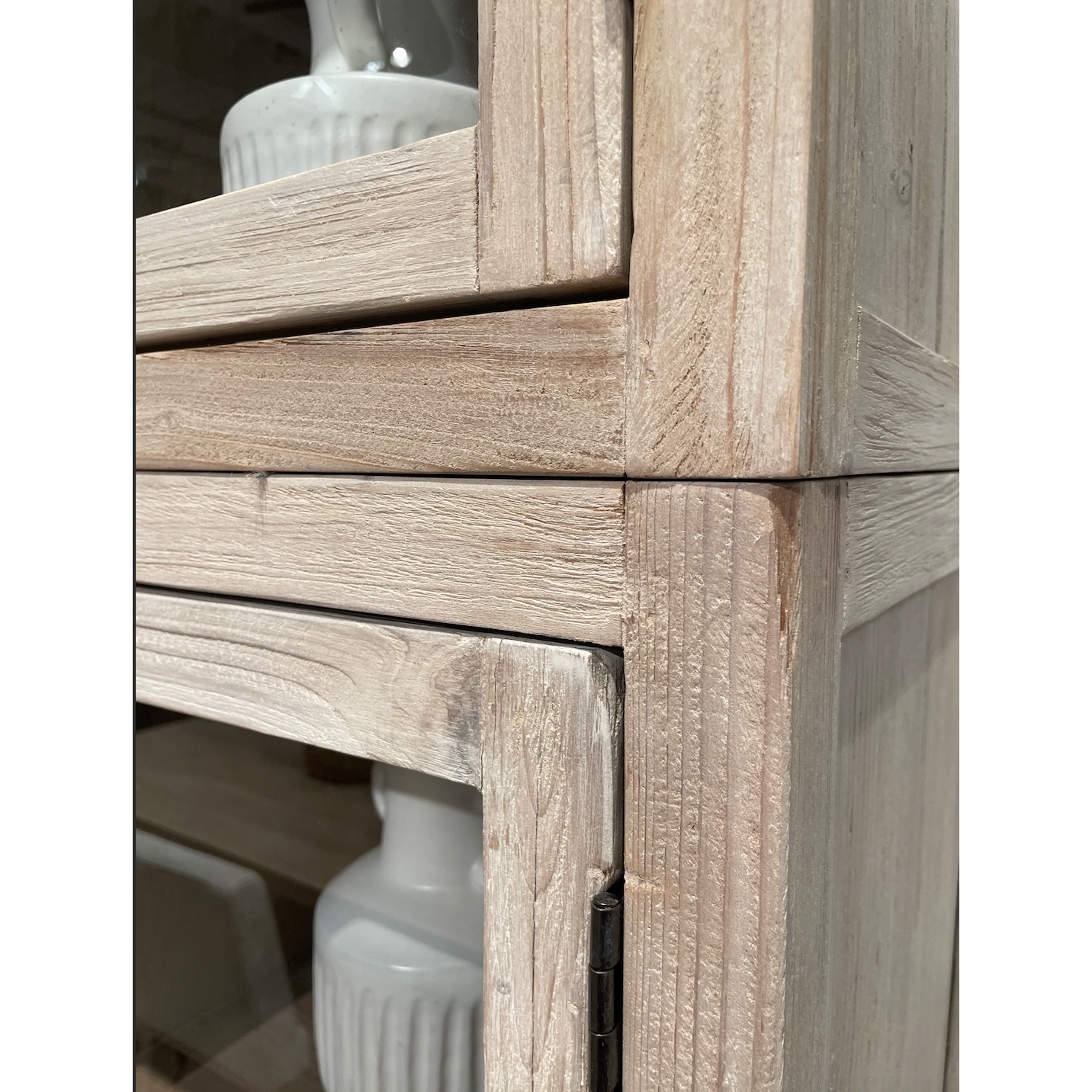 This Haley Cabinet has ample storage, with glass door panels opening to shelves and a bottom sliding door that opens to more shelves. Made from reclaimed pine with a white wash grey sealed finish, this brings an antique feel to any room.  Reclaimed Pine  White Wash Grey Sealed Finish  Flat Glass Door Panels