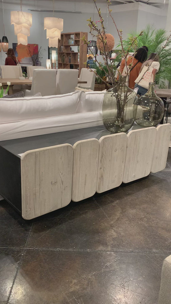 We love the rounded edges and different size doors of this Nubla Sideboard. The grey white antique finish brings an antique vibe to modern spaces.  Reclaimed Pine on Iron Frame Grey White and Antique Black Finish Size: 73"l x 19"d x 25"h 