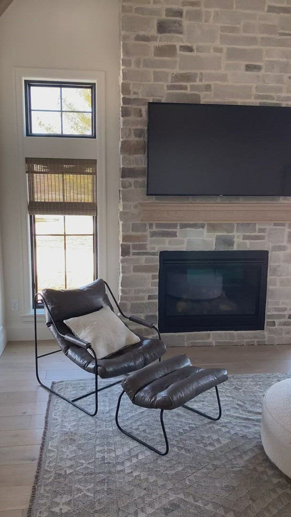 This gorgeous custom leather ottoman, the Brando Leather Ottoman by Cisco Brothers, pairs well with our Brando Chair, also from Cisco Brothers. As shown in Spur Terracotta in a Grade 500 leather. Lifestyle shots in the dark leather are discontinued.  Ottoman size: 25"w x 20"d x 16.5"h