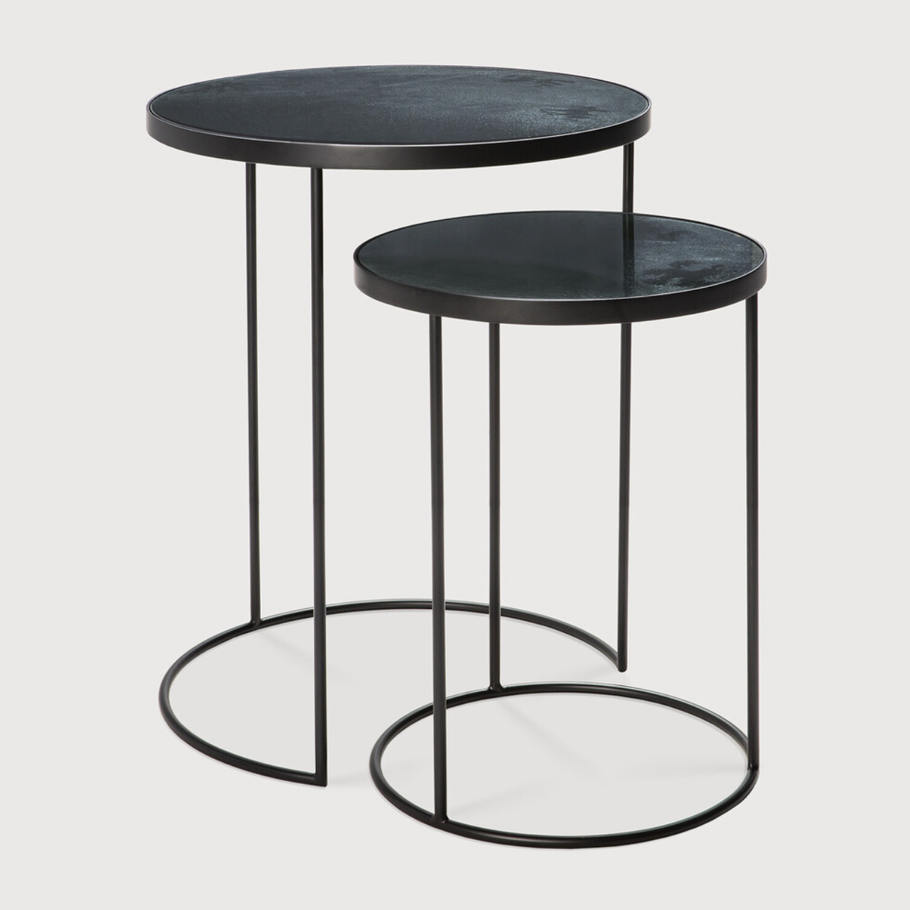 Featuring a heavy aged mirror surface, this Charcoal Nesting Side Table Set brings a unique look to any space. Place beside the sofa, sitting next to your bed, or as a complementary piece to a work of art, its adaptability offers many possibilities.  Dimensions: 22.5"w x 22.5"d x 27.5"h   Material: Mirror