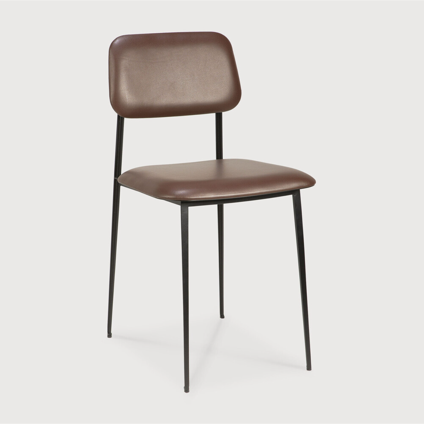 This DC Dining Chair is beautiful, minimalistic metal silhouette that would add an air of elegance to your dining table or kitchen. We love the details of the angled metal and the simplicity of this stunning chair.  Dimensions: 17"w x 19"d x 32.5"h  Weight: 19 lbs  Seat Height: 20"  Material: Metal Finish: Chocolate Leather Upholstery