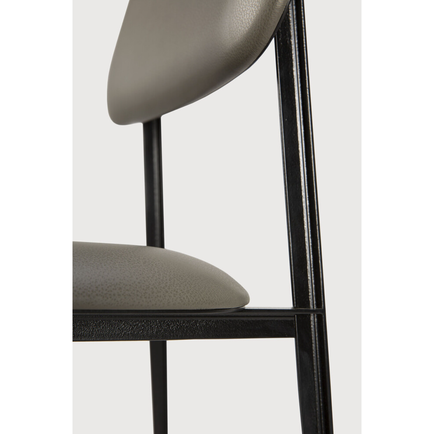 This DC Dining Chair is beautiful, minimalistic metal silhouette that would add an air of elegance to your dining table or kitchen. We love the details of the angled metal and the simplicity of this stunning chair.  Dimensions: 17"w x 19"d x 32.5"h  Weight: 19 lbs  Seat Height: 20"  Material: Metal Finish: Olive Green Leather Upholstery