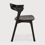This Oak Bok Dining Chair features an airy shape with rock-solid construction,  making this piece a timeless and remarkable design to enjoy for years to come. Pair with a dining table or stand-alone against a wall, hallway, or end of the bed! Designed by Alain can Havre  Dimensions: 20"w x 21.5"d x 30"h  Weight: 15 lbs  Seat Height: 19"  Material: Oak, 100% solid wood Finish: Varnished