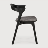 This Oak Bok Dining Chair features an airy shape with rock-solid construction,  making this piece a timeless and remarkable design to enjoy for years to come. Pair with a dining table or stand-alone against a wall, hallway, or end of the bed! Designed by Alain can Havre  Dimensions: 20"w x 21.5"d x 30"h  Weight: 15 lbs  Seat Height: 19"  Material: Oak, 100% solid wood Finish: Varnished