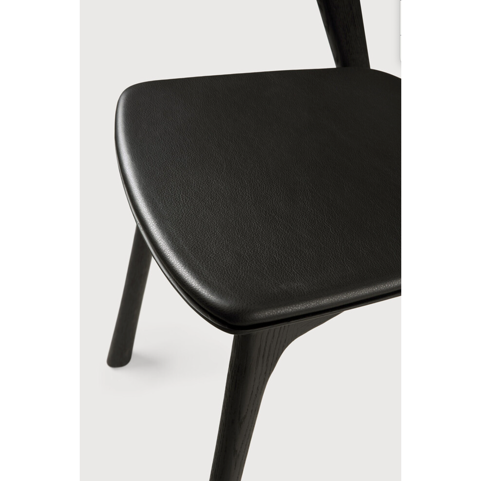 This Oak Bok Dining Chair features an airy shape with rock-solid construction,  making this piece a timeless and remarkable design to enjoy for years to come. Pair with a dining table or stand-alone against a wall, hallway, or end of the bed! Designed by Alain can Havre  Dimensions: 20"w x 21.5"d x 30"h  Weight: 15 lbs  Seat Height: 19"  Material: Oak, 100% solid wood Finish: Varnished