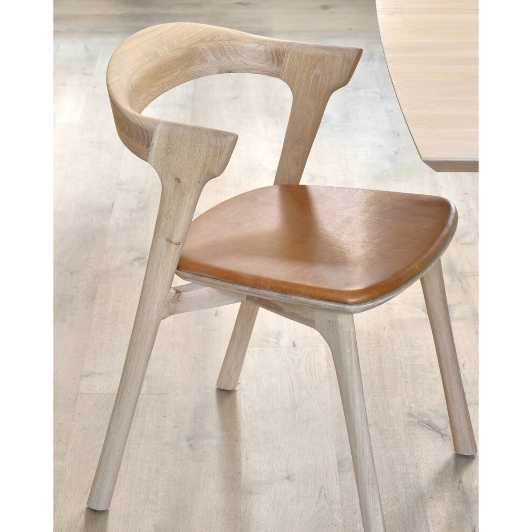 This Oak Bok Dining Chair features an airy shape with rock-solid construction,  making this piece a timeless and remarkable design to enjoy for years to come. Pair with a dining table or stand-alone against a wall, hallway, or end of the bed! Designed by Alain can Havre  Dimensions: 20"w x 21.5"d x 30"h  Weight: 15 lbs  Seat Height: 19"  Material: Oak, 100% solid wood Finish: Varnished