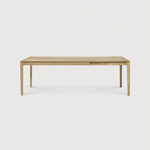 This Oak Bok Extendable Dining Table is perfect for families who want extra space when their kids, extended family, or guests come to celebrate! Its airy shape yet rock solid construction make this piece a timeless and remarkable design to enjoy for years to come.  Material: Oak, 100% Solid Wood Finish: Oiled