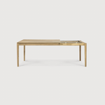 This Oak Bok Extendable Dining Table is perfect for families who want extra space when their kids, extended family, or guests come to celebrate! Its airy shape yet rock solid construction make this piece a timeless and remarkable design to enjoy for years to come.  Material: Oak, 100% Solid Wood Finish: Oiled