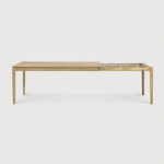This Oak Bok Extendable Dining Table is perfect for families who want extra space when their kids, extended family, or guests come to celebrate! Its airy shape yet rock solid construction make this piece a timeless and remarkable design to enjoy for years to come.  Material: Oak, 100% Solid Wood Finish: Oiled
