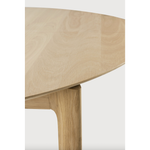 Featuring Oak Bok Round Extendable Dining Table by Ethnicraft at Amethyst Home. This Oak Bok Round Extendable Dining Table offers the perfect solution for adaptable dining within a smaller space. The iconic airy shape and solid construction make for a timeless design to enjoy for years to come.
Material: Oak, 100% Solid WoodFinish: Oiled
Dimensions: 51"w .  Amethyst Home provides interior design, new home construction design consulting, vintage area rugs, and lighting in the Washington metro area.