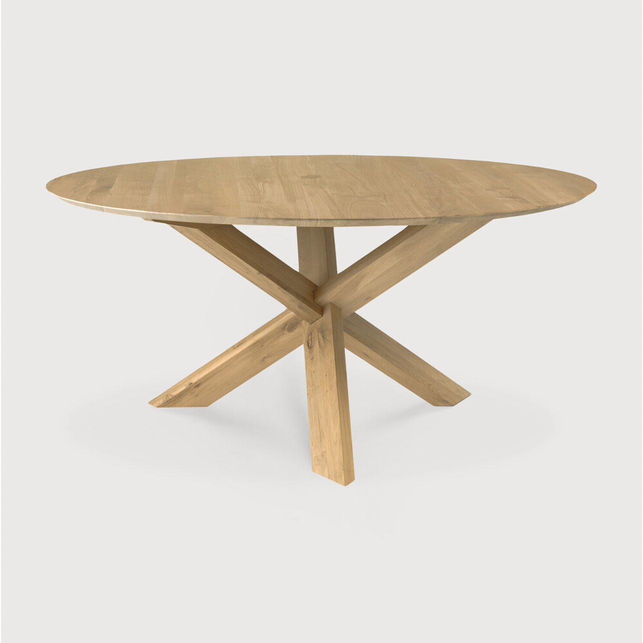 This Oak Circle Round Dining Table is all about inspiring your family to spend a little more time at the table. The solid legs intertwine in perfect balance to create a unique, bright look to any kitchen or dining area.   Material: Oak, 100% Solid Wood Finish: Varnished