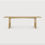 With enriched shapes and unexpected details, this Oak Geometric Dining Table is a statement item. Luxury comes with its length, which is offset by softened edges and natural lines -- perfect for any dining room or workspace.   Material: Oak, 100% Solid Wood Finish: Oiled