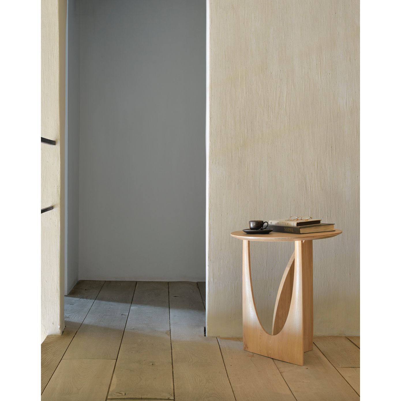 From any angle, the Oak Geometric Side Table does not only look different, it also becomes different. We love seeing this table as a sculptural accent to your living space or office.  Designed by Alain van Havre  Dimensions: 20.5"w x 20.5"d x 20"h  Weight: 11 lbs  Material: Oak Finish: Varnished