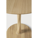 Featuring Oak Round Torsion Dining Table by Ethnicraft at Amethyst Home. Airy with subtle complexities, this Oak Round Torsion Dining Table incorporates advanced woodworking techniques to create a light table top with a torsaded base of sculptural elegance -- sure to elevate the look for any dining or kitchen area. 
Material: Oak, 100% Solid WoodFinish: V.  Amethyst Home provides interior design, new home construction design consulting, vintage area rugs, and lighting in the Washington metro area.