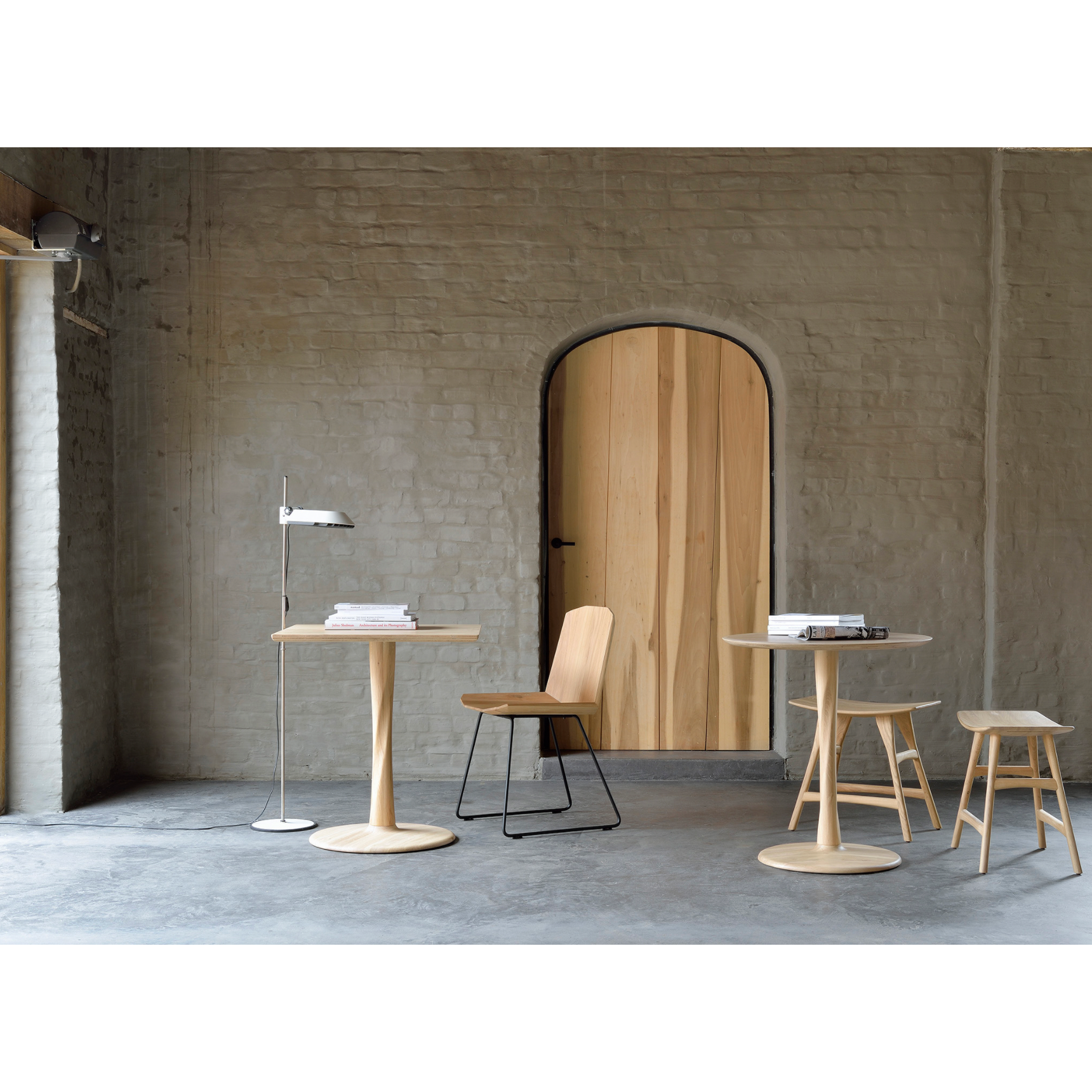Airy with subtle complexities, this Oak Round Torsion Dining Table incorporates advanced woodworking techniques to create a light table top with a torsaded base of sculptural elegance -- sure to elevate the look for any dining or kitchen area.   Material: Oak, 100% Solid Wood Finish: Varnished