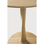 Featuring Oak Round Torsion Dining Table by Ethnicraft at Amethyst Home. Airy with subtle complexities, this Oak Round Torsion Dining Table incorporates advanced woodworking techniques to create a light table top with a torsaded base of sculptural elegance -- sure to elevate the look for any dining or kitchen area. 
Material: Oak, 100% Solid WoodFinish: Varn.  Amethyst Home provides interior design, new home construction design consulting, vintage area rugs, and lighting in the Houston metro area.