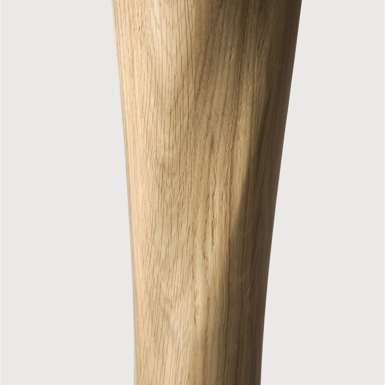Airy with subtle complexities, this Oak Round Torsion Dining Table incorporates advanced woodworking techniques to create a light table top with a torsaded base of sculptural elegance -- sure to elevate the look for any dining or kitchen area.   Material: Oak, 100% Solid Wood Finish: Varnished
