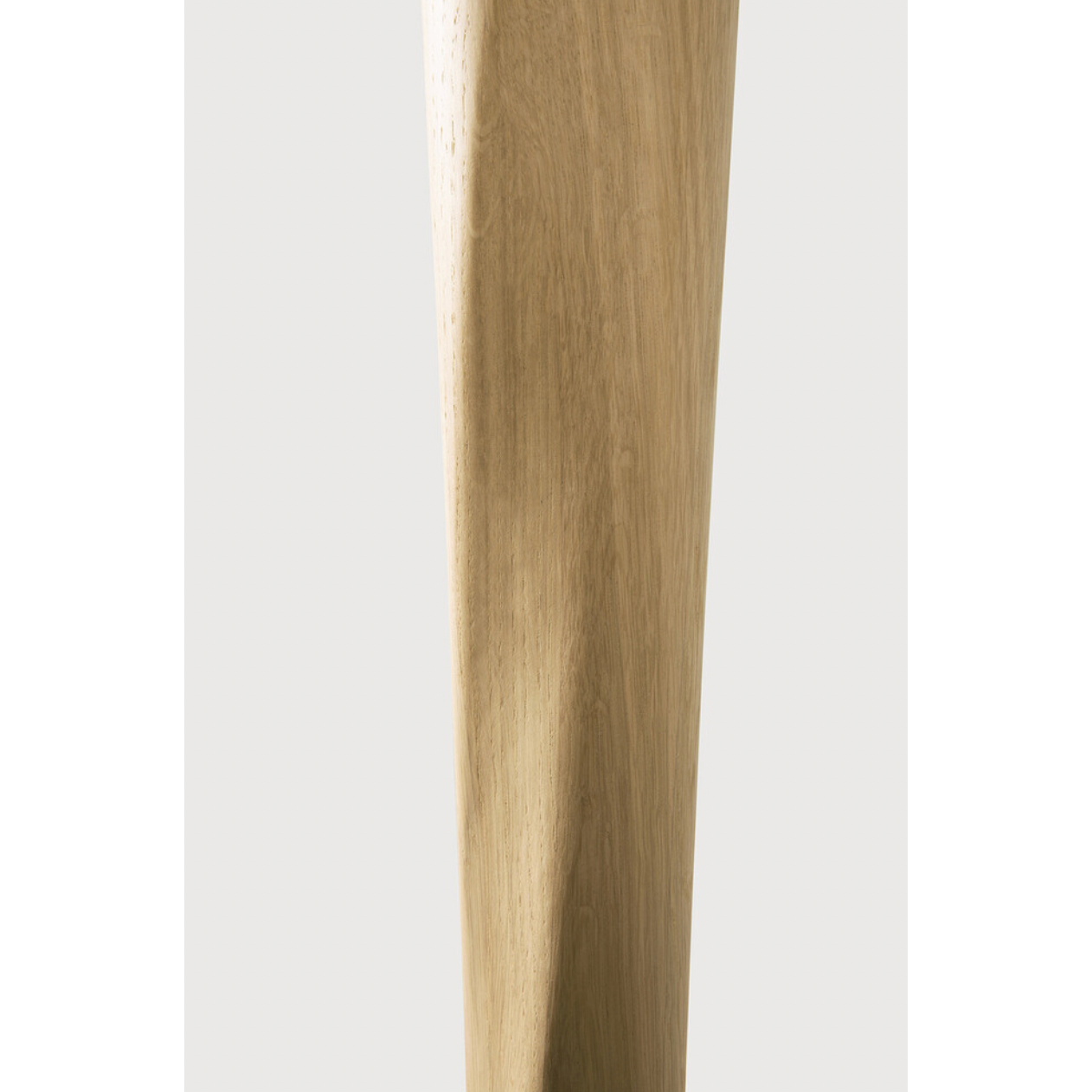 Airy with subtle complexities, this Oak Round Torsion Dining Table incorporates advanced woodworking techniques to create a light table top with a torsaded base of sculptural elegance -- sure to elevate the look for any dining or kitchen area.   Material: Oak, 100% Solid Wood Finish: Varnished