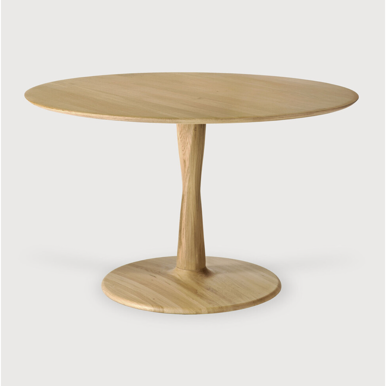 Airy with subtle complexities, this Oak Round Torsion Dining Table incorporates advanced woodworking techniques to create a light table top with a torsaded base of sculptural elegance -- sure to elevate the look for any dining or kitchen area.   Material: Oak, 100% Solid Wood Finish: Varnished