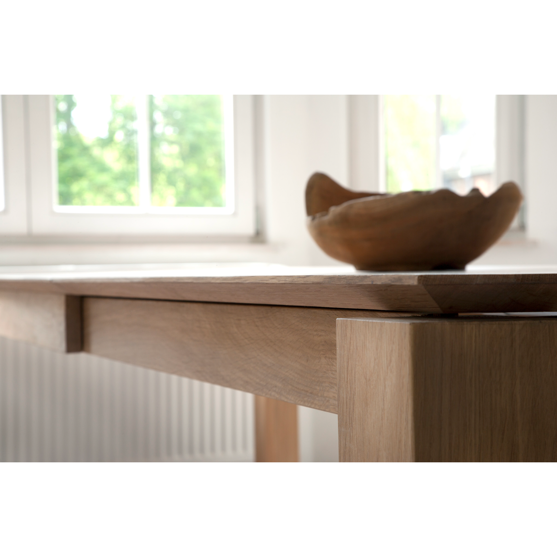 This Oak Slice Extendable Dining Table features a unique character with just a little extra added. This table can easily be extended without interruption of the wood grain pattern -- perfect for gathering your family or friends for hosting parties or the holidays!   Material: Oak, 100% Solid Wood Finish: Oiled