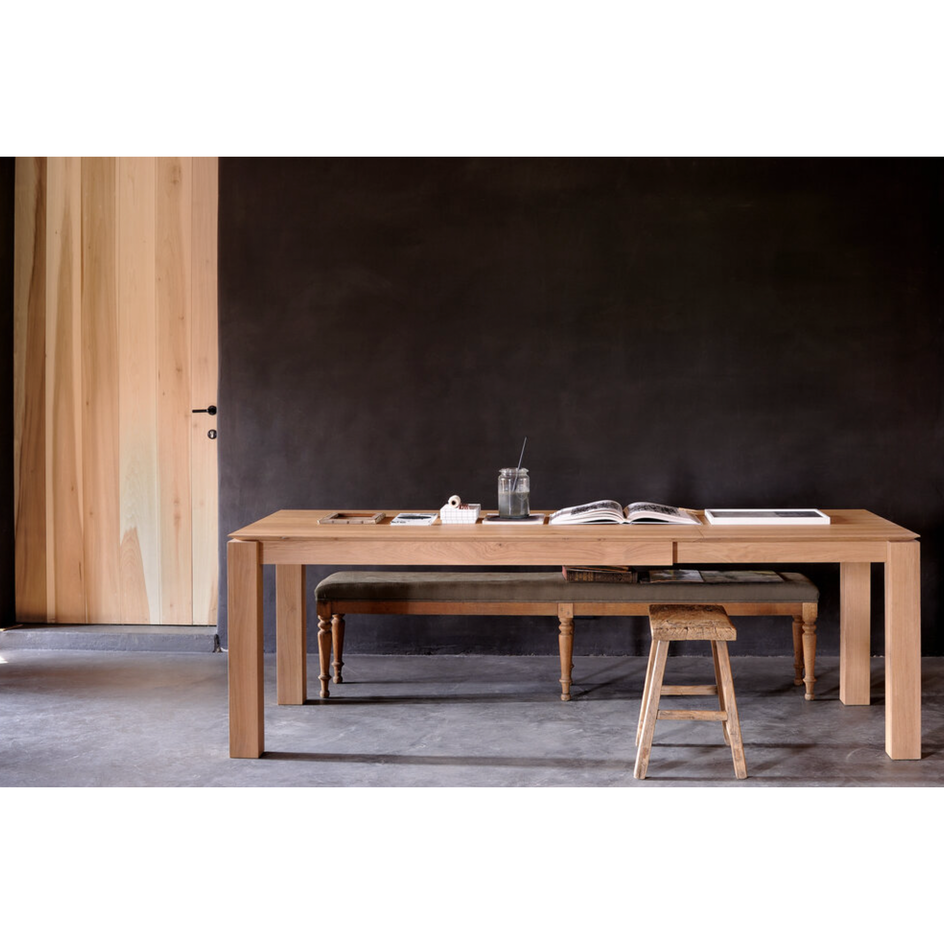 This Oak Slice Extendable Dining Table features a unique character with just a little extra added. This table can easily be extended without interruption of the wood grain pattern -- perfect for gathering your family or friends for hosting parties or the holidays!   Material: Oak, 100% Solid Wood Finish: Oiled