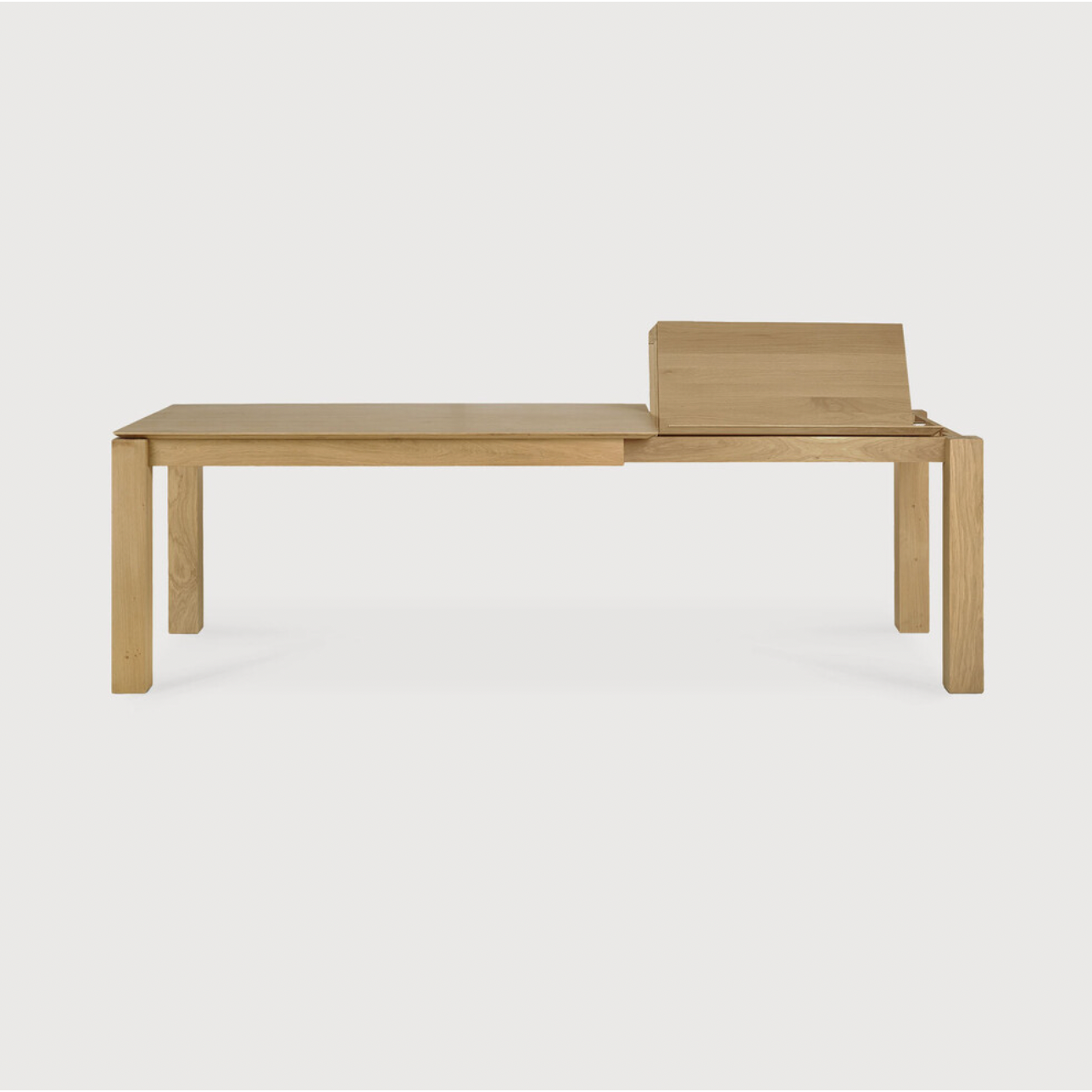 This Oak Slice Extendable Dining Table features a unique character with just a little extra added. This table can easily be extended without interruption of the wood grain pattern -- perfect for gathering your family or friends for hosting parties or the holidays!   Material: Oak, 100% Solid Wood Finish: Oiled