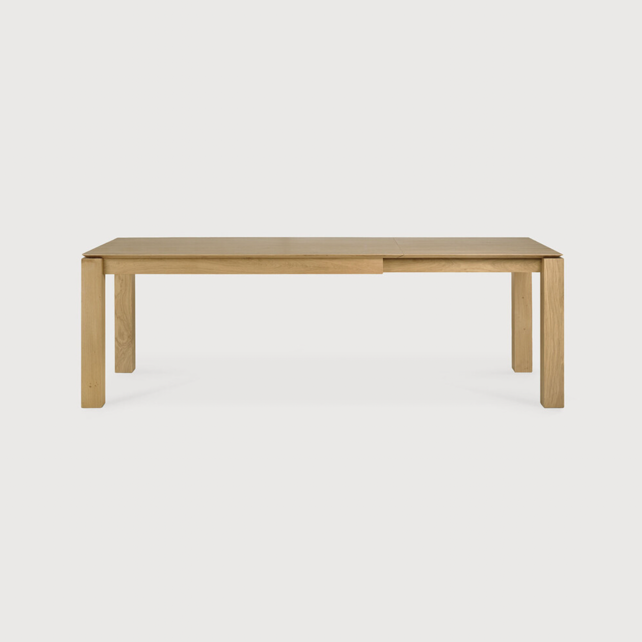 This Oak Slice Extendable Dining Table features a unique character with just a little extra added. This table can easily be extended without interruption of the wood grain pattern -- perfect for gathering your family or friends for hosting parties or the holidays!   Material: Oak, 100% Solid Wood Finish: Oiled