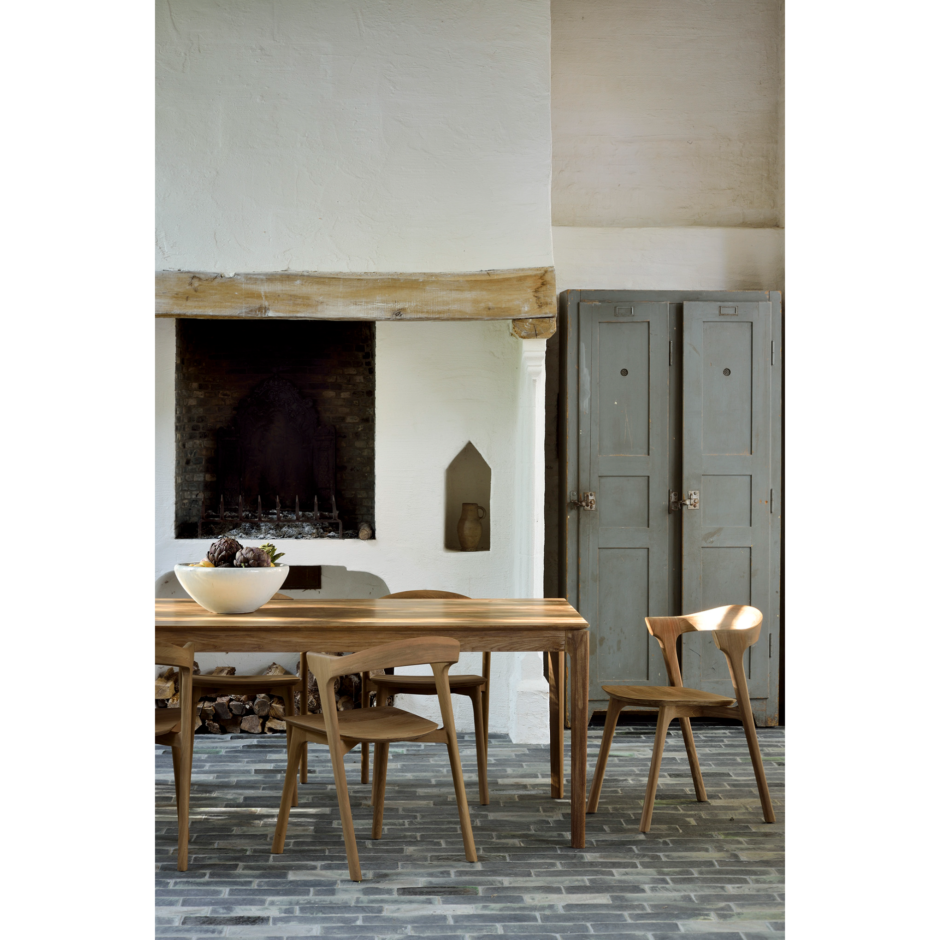 This Teak Bok Dining Chair features an airy shape with rock-solid construction,  making this piece a timeless and remarkable design to enjoy for years to come. Pair with a dining table or stand-alone against a wall, hallway, or end of the bed! Designed by Alain can Havre  Dimensions: 20"w x 21.5"d x 30"h  Weight: 12 lbs  Seat Height: 18"  Material: Oak, 100% solid wood Finish: Varnished