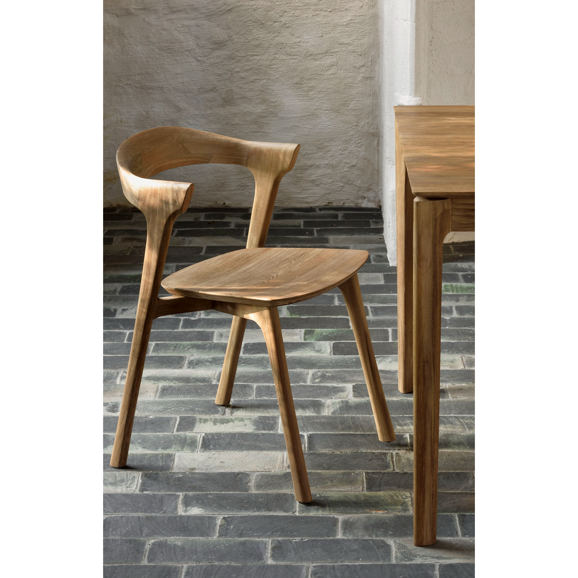 This Teak Bok Dining Chair features an airy shape with rock-solid construction,  making this piece a timeless and remarkable design to enjoy for years to come. Pair with a dining table or stand-alone against a wall, hallway, or end of the bed! Designed by Alain can Havre  Dimensions: 20"w x 21.5"d x 30"h  Weight: 12 lbs  Seat Height: 18"  Material: Oak, 100% solid wood Finish: Varnished