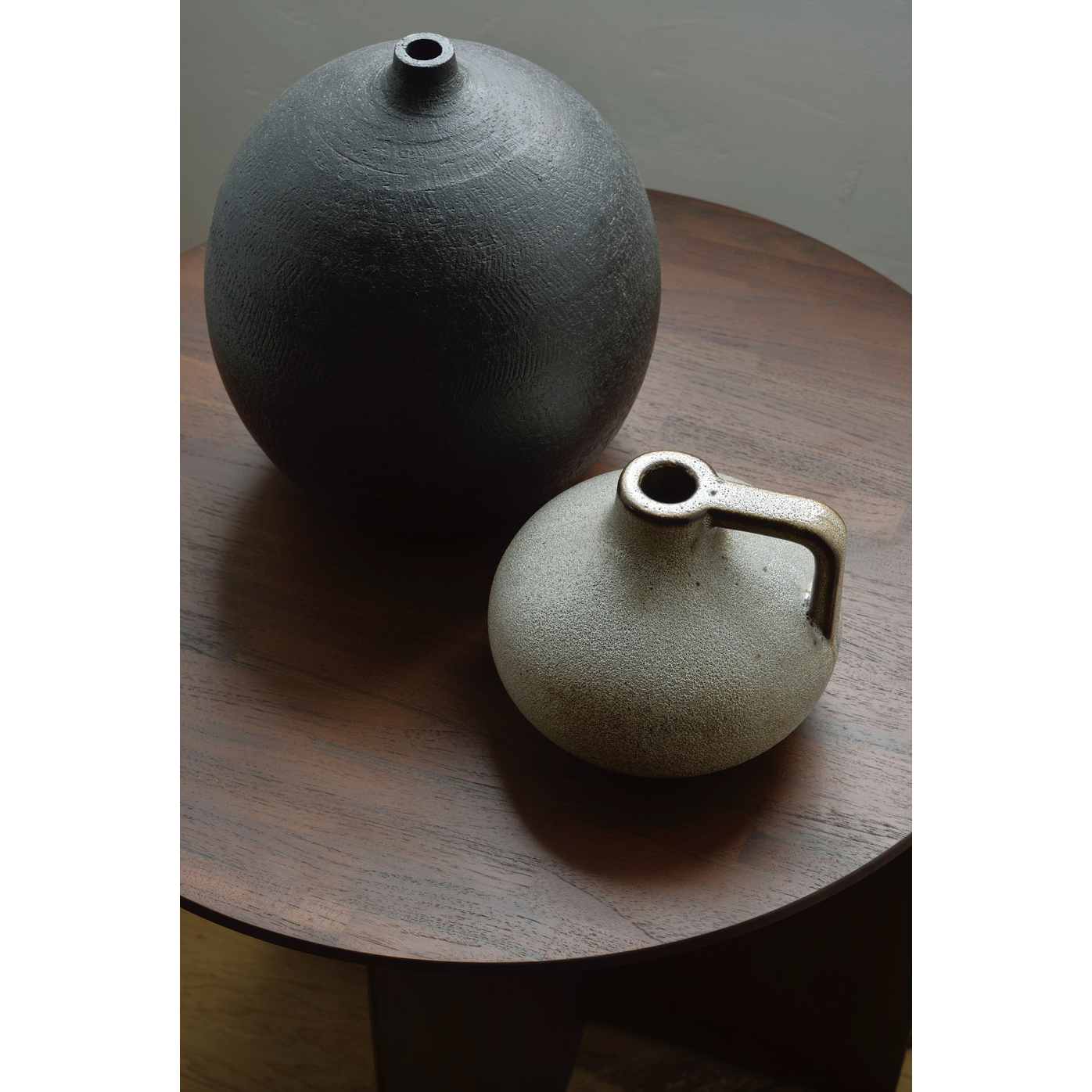 From any angle, the Teak Geometric Side Table does not only look different, it also becomes different. We love seeing this table as a sculptural accent to your living space or office.  Designed by Alain van Havre  Dimensions: 20.5"w x 20.5"d x 20"h  Weight: 11 lbs  Material: Teak Finish: Varnished