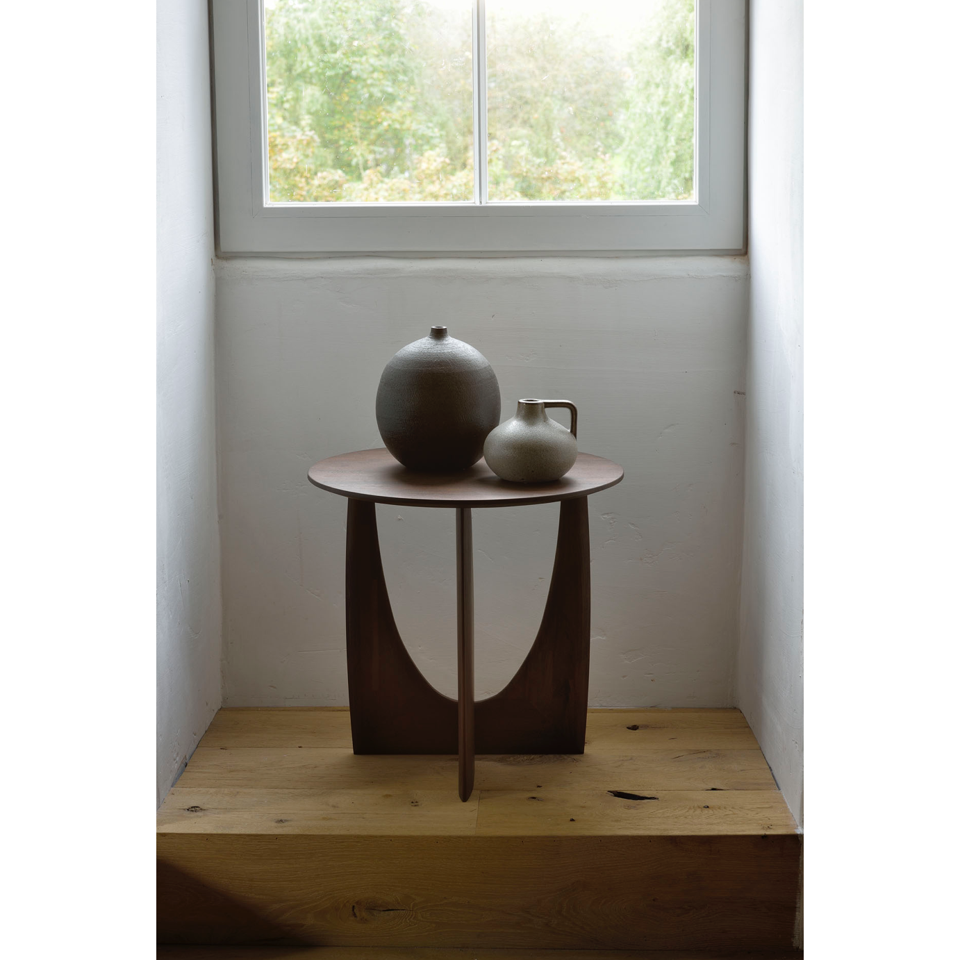 From any angle, the Teak Geometric Side Table does not only look different, it also becomes different. We love seeing this table as a sculptural accent to your living space or office.  Designed by Alain van Havre  Dimensions: 20.5"w x 20.5"d x 20"h  Weight: 11 lbs  Material: Teak Finish: Varnished