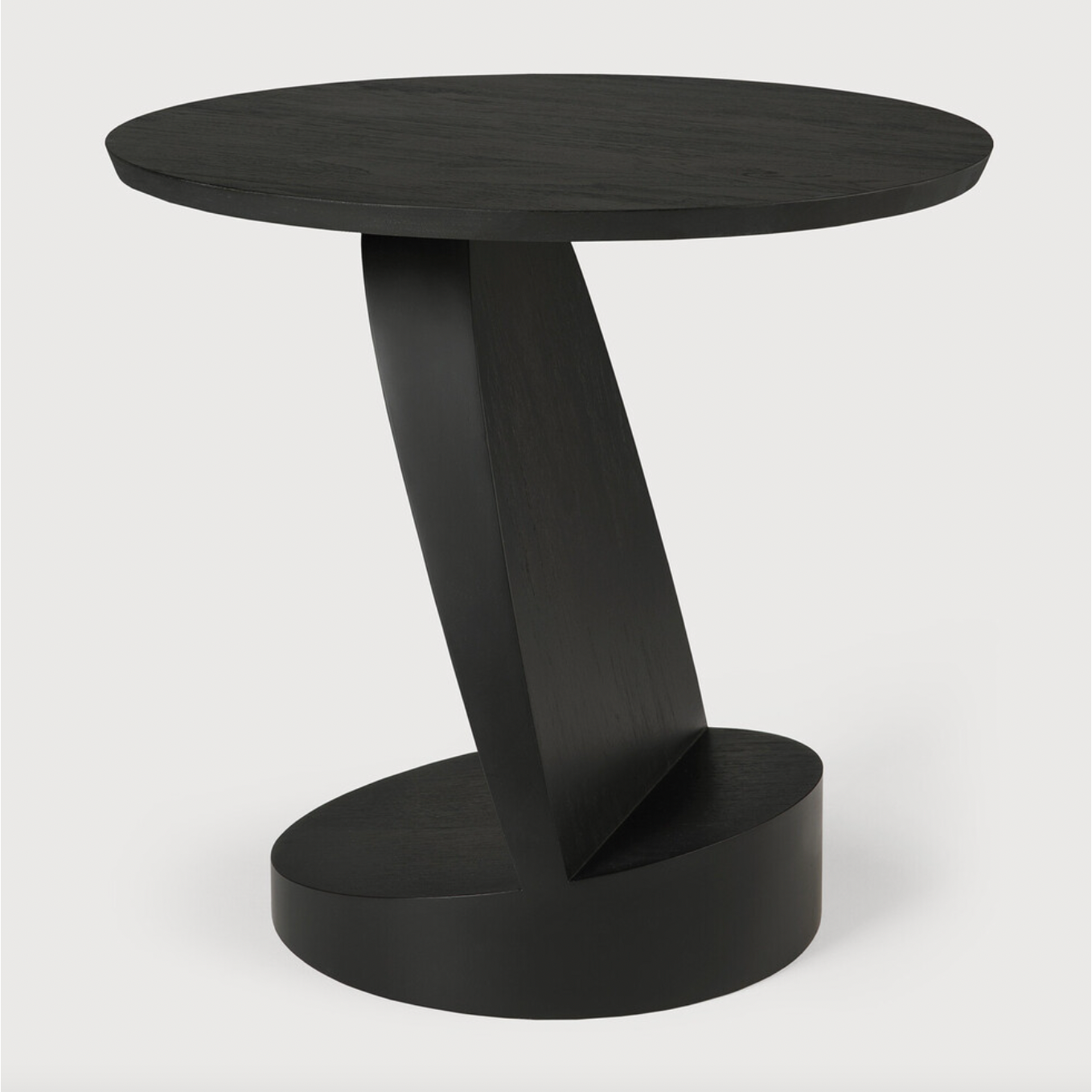 We love the unique base of this Teak Oblic Side Table - Black. Place near your sofa, bed side table, or accent chair to completely elevate the space!  Dimensions: 20.5"w x 20.5"d x 19.5"h  Weight: 21 lbs  Material: Teak, 100% Solid Wood Finish: Varnished