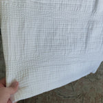 Crafted in Portugal, the Nantucket White Matelasse by Pom Pom at Home is a modern take on the matelasse with its beautiful interwoven weave. We love the soft, puckered appearance this brings to a bedroom.  100% cotton. Machine wash cold; tumble dry low; warm iron as needed. Do not bleach      