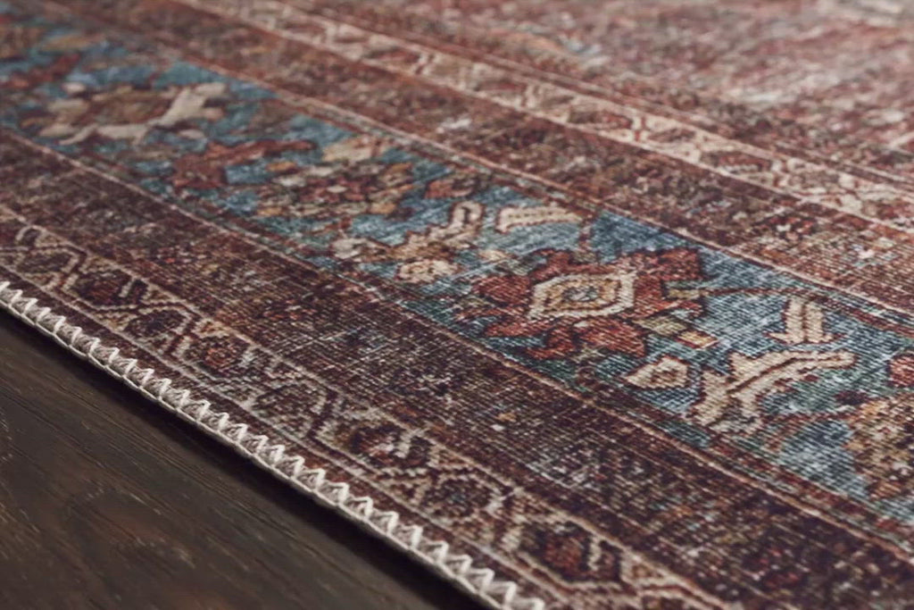 The Layla Collection is traditional and timeless, with a beautiful lived-in design that captures the spirit of an old-world rug. This traditional power-loomed rug is crafted of 100% polyester with a classic and sophisticated color palette and subtle patina.  Power Loomed 100% Polyester LAY-01 Brick/Blue