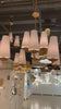 The Fontaine Large Offset Chandelier by Visual Comfort has a slim cross section at the bottom matched with offset layers of linen shades. This is a gorgeous piece to add to any dining room, living room, or other large area.   Designer: AERIN