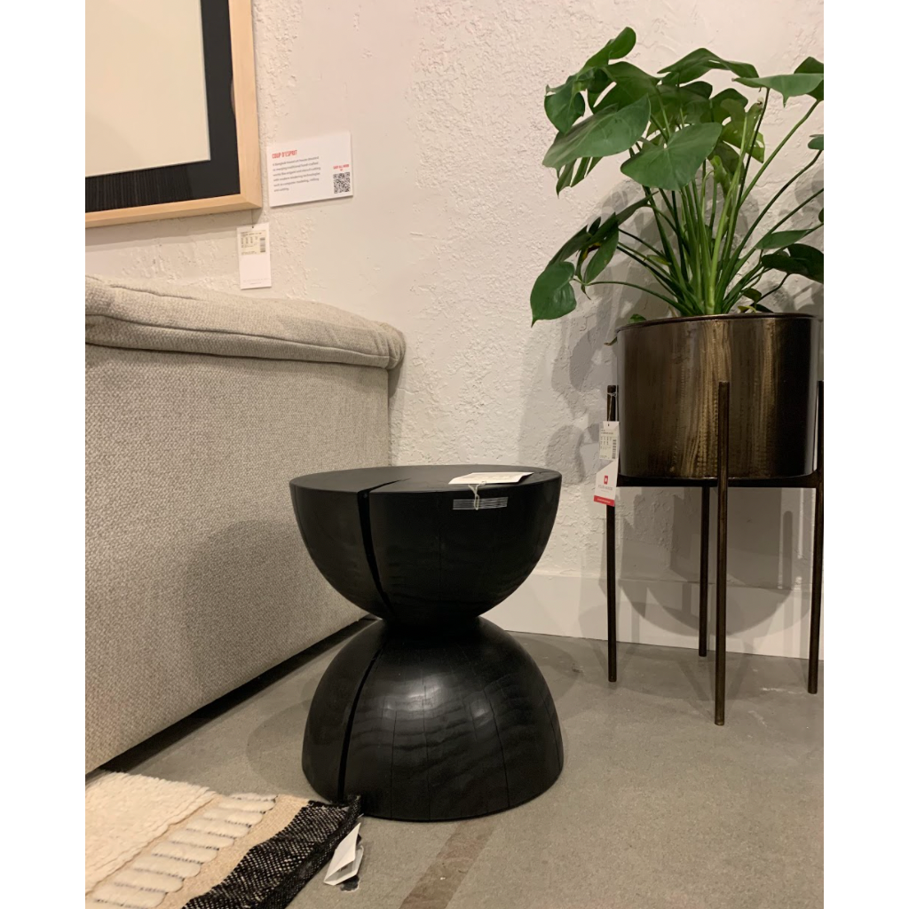 Solid black-finished pine sculpts an hourglass silhouette for an organic look with this Aliza End Table. Makes for a handy extra surface solo or paired! Due to materials' natural essence, cracks are to be expected and may develop over time. Knots, color variance and stain will vary from piece to piece - no two are alike. Amethyst Home provides interior design, new home construction design consulting, vintage area rugs, and lighting in the Nashville metro area.