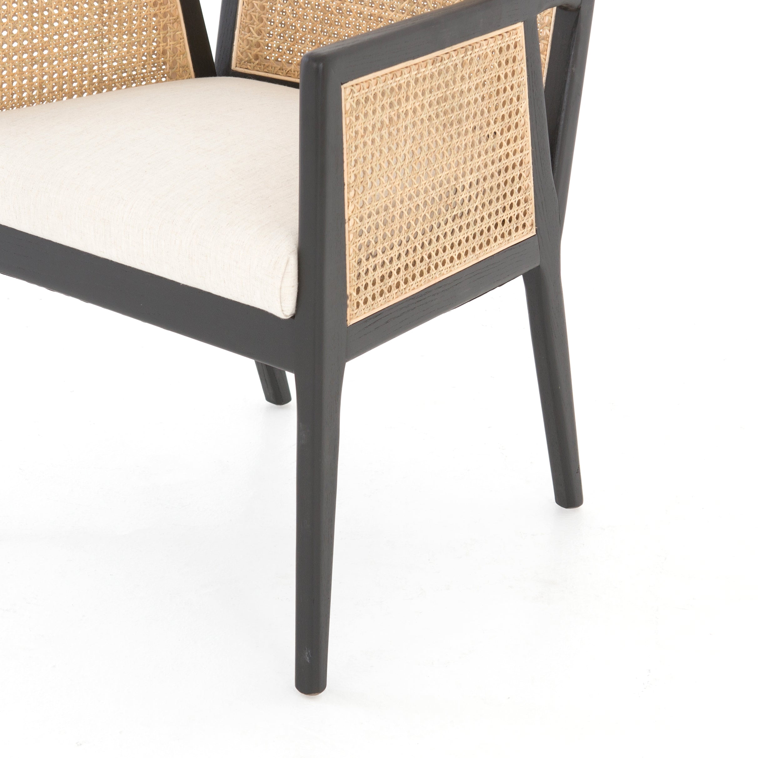 We loved the retro look of this Antonia Cane Dining Armchair - Brushed Ebony. The brushed ebony nettlewood frames paired with the natural cane brings the perfect contract to any dining room or kitchen area.   Overall Dimensions: 22.75"w x 23.50"d x 33.00"h