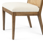 The love the retro style the natural cane of this Antonia Cane Toasted Nettlewood Armless Dining Chair brings to a dining room.   Overall Dimensions: 22.50"w x 23.50"d x 33.00"h Seat Depth: 19.25" Seat Height: 19.5"  Colors: Natural Cane, Toasted Nettlewood, Savile Flax Materials: Cane, Solid Nettlewood, 92% Pl, 8% Li