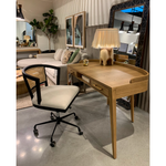Featuring Armstrong Desk - Burnished Oak by Four Hands at Amethyst Home. With dramatically tapered legs and a slender silhouette, this Armstrong Desk - Burnished Oak is made of light-burnished oak and places a femme, functional twist on mid-century styling. Dual drawers plus an open center cubby for handy office supply storage.
Overall Dimensions: 55.50"W .  Amethyst Home provides interior design, new home construction design consulting, vintage area rugs, and lighting in the Charlotte metro area.