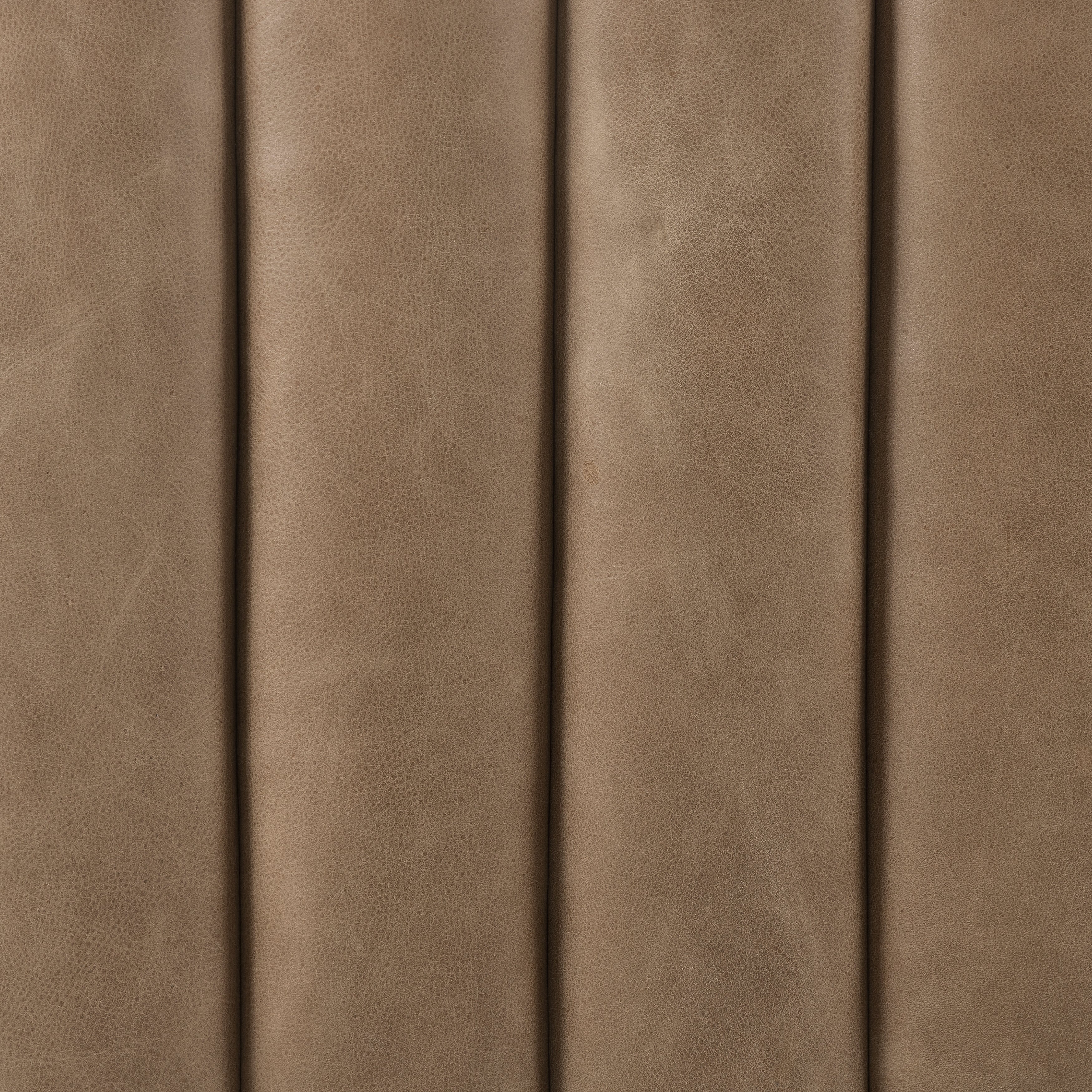 This Augustine 97" Sofa - Palermo Drift features dramatically channeled upholstered in taupe top-grain leather. We love the crisp, clean look and sumptuous sit this offers to a space!   Size: 97"w x 35"d x 26.5"h