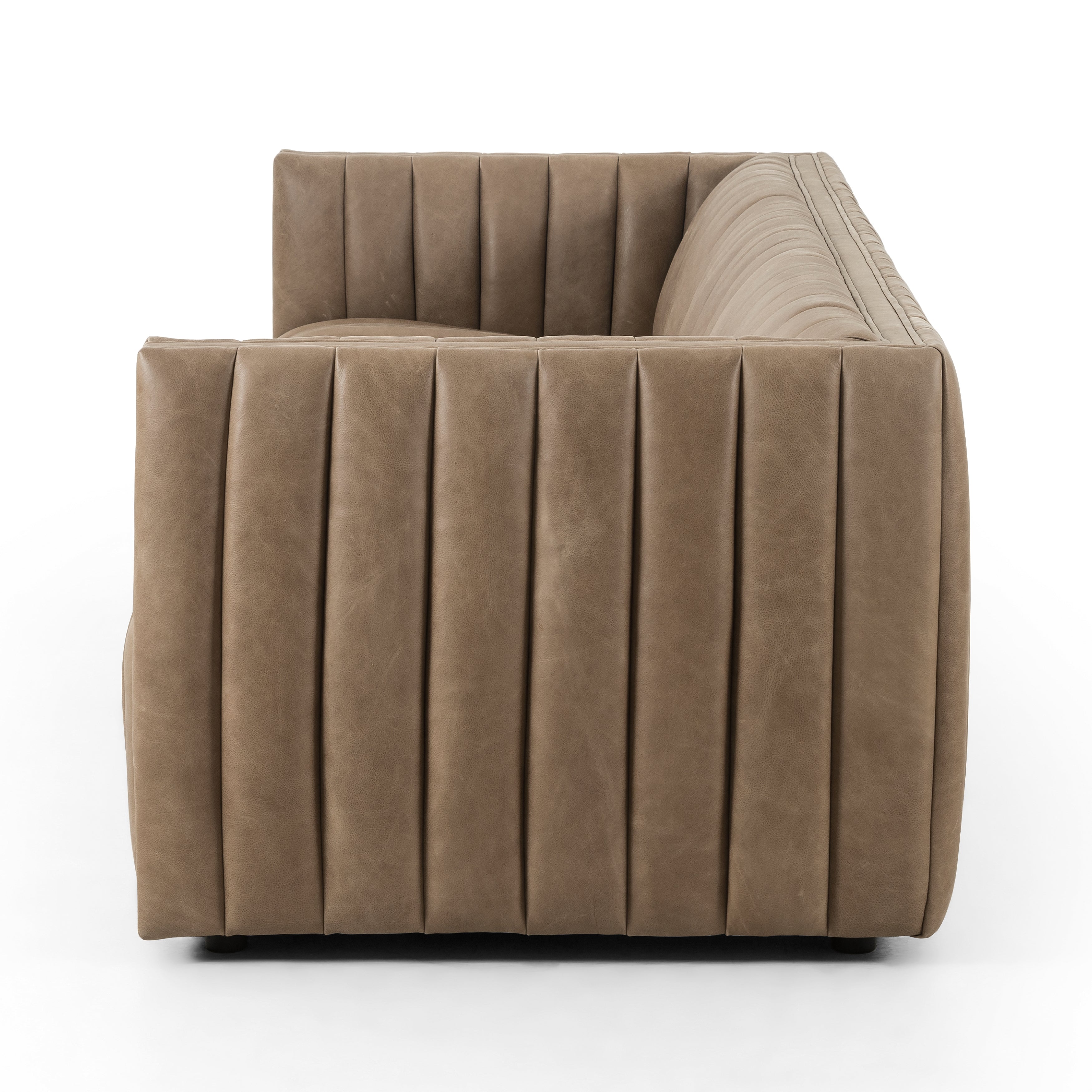 This Augustine 97" Sofa - Palermo Drift features dramatically channeled upholstered in taupe top-grain leather. We love the crisp, clean look and sumptuous sit this offers to a space!   Size: 97"w x 35"d x 26.5"h