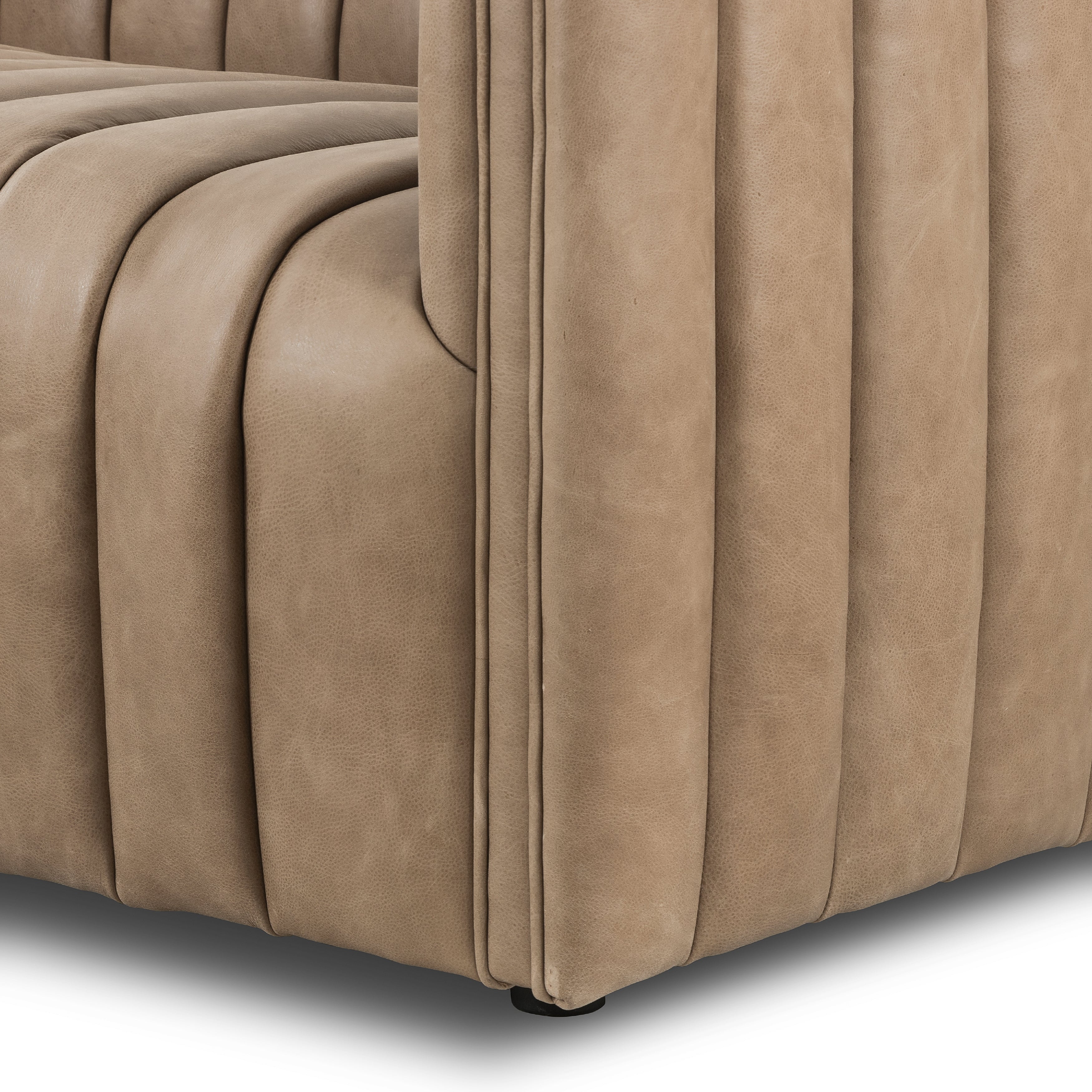 This Augustine 97" Sofa - Palermo Drift features dramatically channeled upholstered in taupe top-grain leather. We love the crisp, clean look and sumptuous sit this offers to a space!   Size: 97"w x 35"d x 26.5"h