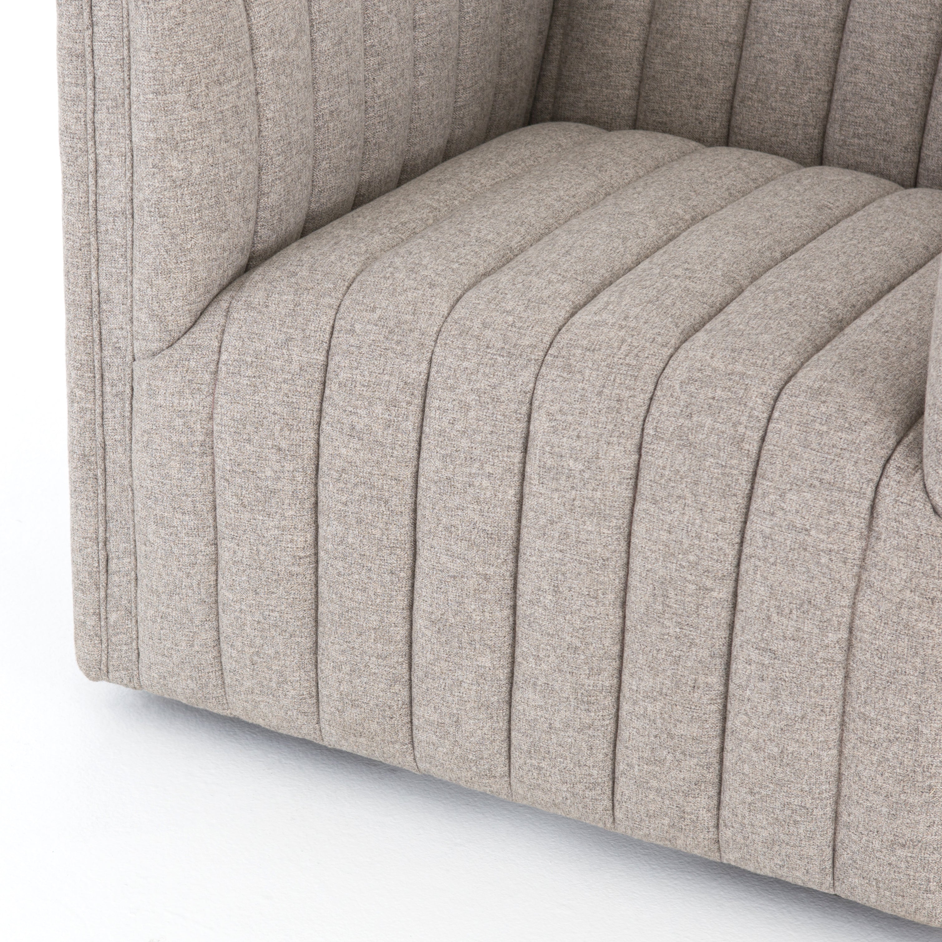 You will love the dramatic channeling of this Augustine Swivel Chair - Orly Natural. The swivel feature sets this apart from other chairs and is a great choice for any living room or media room. This chair is comfort wrapped in soft linen blend making this everyone's favorite chair.  Overall Dimensions: 32.00"w x 34.00"d x 26.50"h