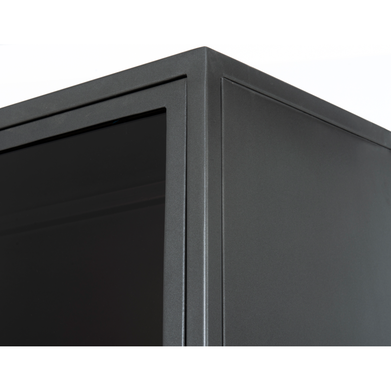 Inspired by the stackable barrister-style shelving, iron casing is finished in a gunmetal for a fresh industrial look, with smoked glass panes with flat brass hardware cover door fronts, each lifting to spacious compartments for storage of books and treasures.  Overall Dimensions: 32.00"w x 15.00"d x 82.00"h  Colors: Smoked Glass, Flat Brass, Gunmetal Materials: Glass, Iron