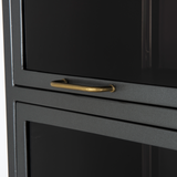 Featuring Aviva Barrister Cabinet by Four Hands at Amethyst Home. Inspired by the stackable barrister-style shelving, iron casing is finished in a gunmetal for a fresh industrial look, with smoked glass panes with flat brass hardware cover door fronts, each lifting to spacious compartments for storage of books and treasures.
Overall Dimensions: 32"W x 1.  Amethyst Home provides interior design, new home construction design consulting, vintage area rugs, and lighting in the Laguna Beach metro area.