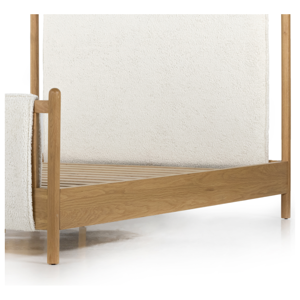 Bring a cozy hygge vibe to the bedroom with this textured Bowen Bed. Framed by light-finished solid oak, a sling-style bed features faux shearling head and foot boards -- sure to elevate any bedroom.   Queen Overall Dimensions: 64.25"w x 87.25"d x 48.00"h King Overall Dimensions: 80.25"w x 88.50"d x 48.00"h